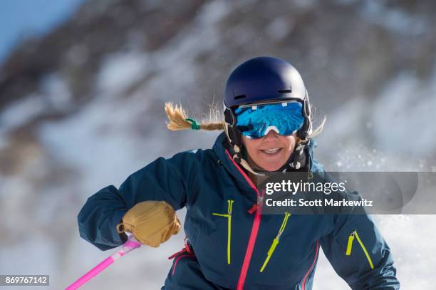 a woman skiing on a sunny winter day - extreme sports stock pictures, royalty-free photos & images