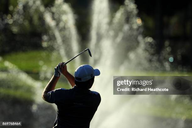 Eddie Pepperell of England hits his second shot on the 18th hole during the second round of the Turkish Airlines Open at the Regnum Carya Golf & Spa...