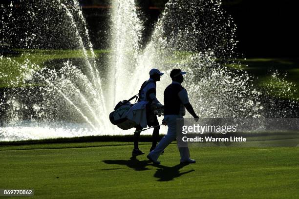 Kiradech Aphibarnrat of Thailand walks down the 18th hole during the second round of the Turkish Airlines Open at the Regnum Carya Golf & Spa Resort...