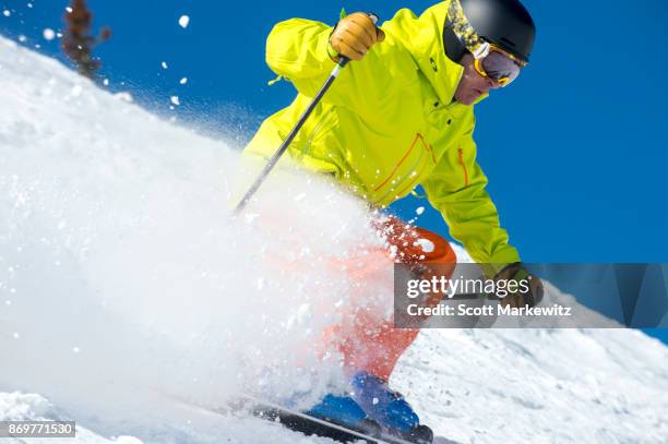 a man skiing on a sunny winter day - snowbird lodge stock pictures, royalty-free photos & images