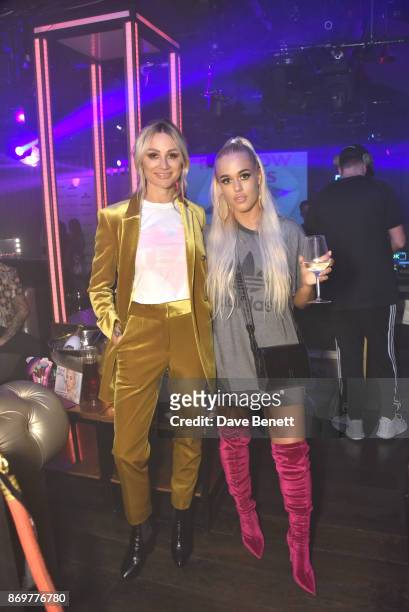 Lou Teasdale and Lottie Tomlinson arrive at Lottie Tomlinson's "Rainbow Roots" book launch at Tape London on November 2, 2017 in London, England.