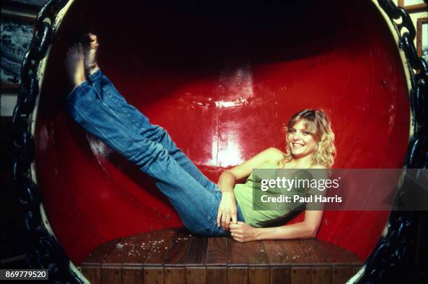 Actress Michelle Pfeiffer lays in a ships air vent at a restaurant called Gladstone's overlooking the Pacific Ocean. Her 1982 film Grease 2 was about...