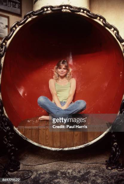 Actress Michelle Pfeiffer lays in a ships air vent at a restaurant called Gladstone's overlooking the Pacific Ocean. Her 1982 film Grease 2 was about...