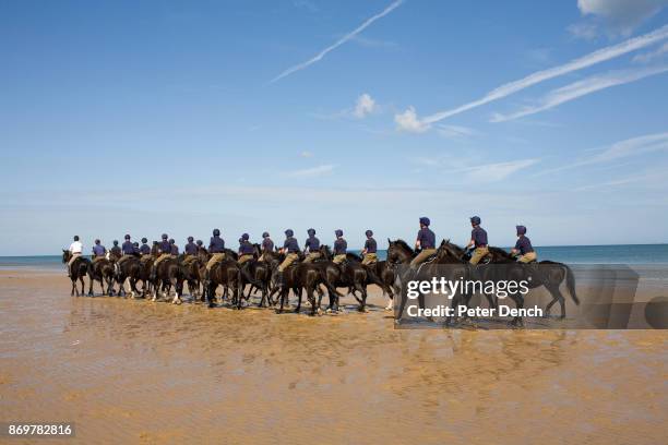 Troopers of the mounted regiment's Blues and Royals squadron enjoy a break from their regular routine at Holkham beach. The Household Cavalry is made...