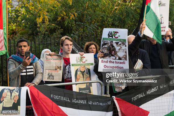 Group of pro-Palestinian demonstrators gathered to protest against Israel's Prime Minister Benjamin Netanyahu, Israeli war crimes and military...