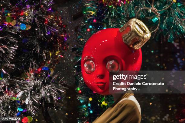 red christmas ball man - daniele carotenuto stock pictures, royalty-free photos & images