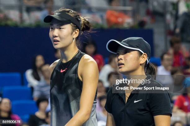 Xinyu Jiang and Qianhui Tang of China talks during the doubles Round Robin match of the WTA Elite Trophy Zhuhai 2017 against Alicja Rosolska of...