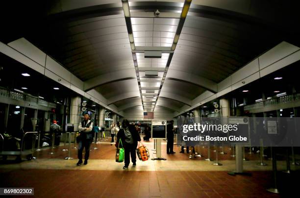 Passengers come and go inside the South Station bus terminal in Boston on Nov. 1, 2017. With a shortage in the bus driver ranks, the Plymouth &...