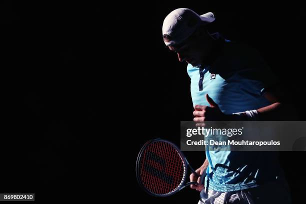 John Isner of the USA warms up prior to his match against Juan Martin del Potro of Argentina during Day 5 of the Rolex Paris Masters held at the...