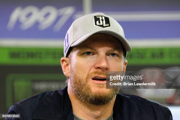 Dale Earnhardt Jr., driver of the Nationwide/Justice League Chevrolet, speaks with the media during a press conference at Texas Motor Speedway on...