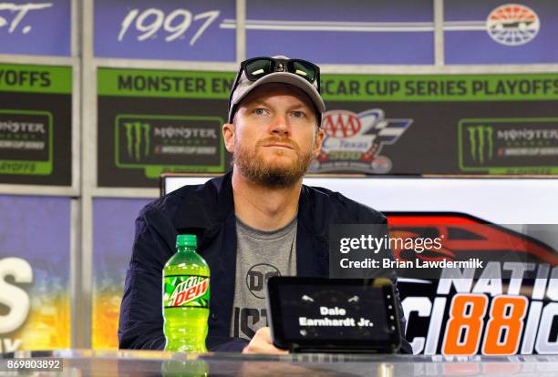 Dale Earnhardt Jr., driver of the Nationwide/Justice League Chevrolet, speaks with the media during a press conference at Texas Motor Speedway on...