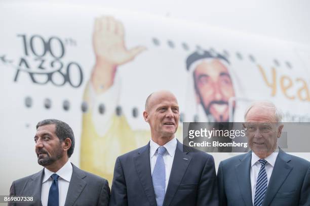 Sheikh Ahmed bin Saeed Al Maktoum, chief executive officer of Emirates Airlines, left, Tom Enders, chief executive officer of Airbus SE, center, and...