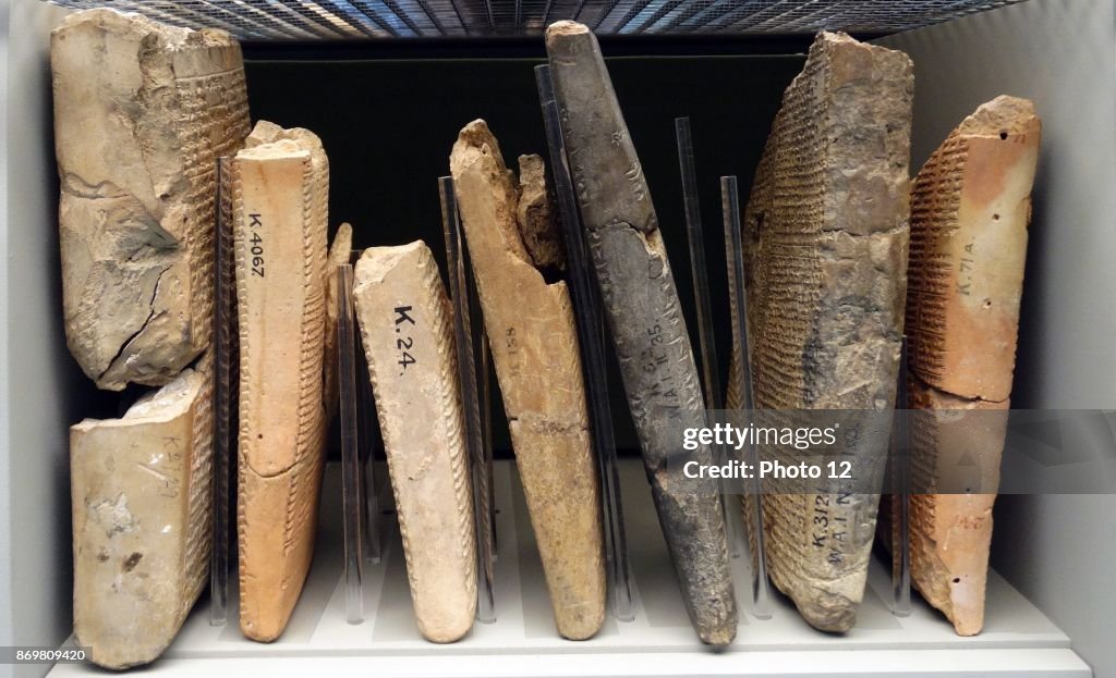 Assyrian cuneiform tablets stored in a museum.