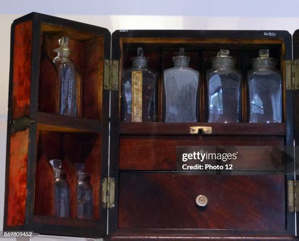Medicine chest. Stocked with many imported ingredients including ginger, rhubarb and quinine. Made from brass, iron and mahogany, 1850-1900.