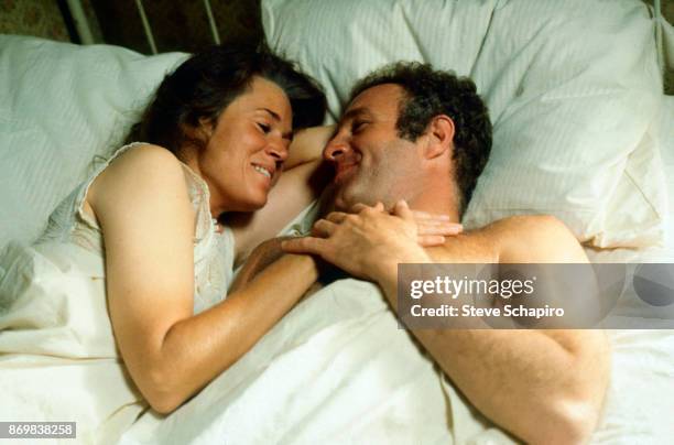 American actors Jane Fonda and James Caan stare at one another as they lie in bed in a scene from the film 'Comes a Horseman' , Arizona, 1977.