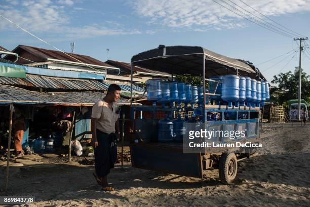 Rakhine Buddhists collect water in the Satroja IDP camp on November 3, 2017 in Sittwe, Myanmar. A segment of the Rakhine Buddhist population was...
