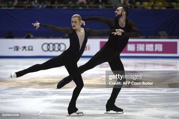 Ice skaters Ashley Cain and Timothy Leduc perform in Pairs Short Program during the Cup of China ISU Grand Prix of Figure Skating, in Beijing, on...