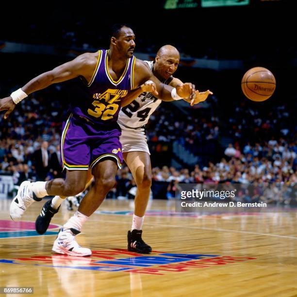Karl Malone of the Utah Jazz and Lloyd Daniels of the San Antonio Spurs battle for the looseball during Game Two of the 1994 Western Conference...