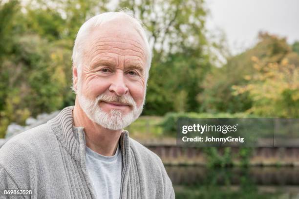 portrait of senior man with white hair and beard smiling - man with gray hair stock pictures, royalty-free photos & images