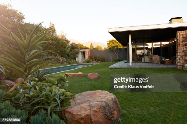 still life of modern beautiful designed house with pool - terrasse grundstück stock-fotos und bilder