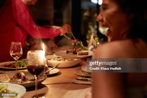 multigenerational family having dinner - dinner party stock pictures, royalty-free photos & images