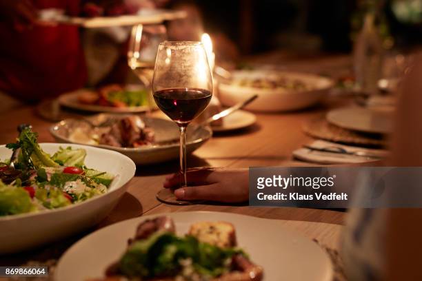 multigenerational family having dinner - evening meal stock pictures, royalty-free photos & images