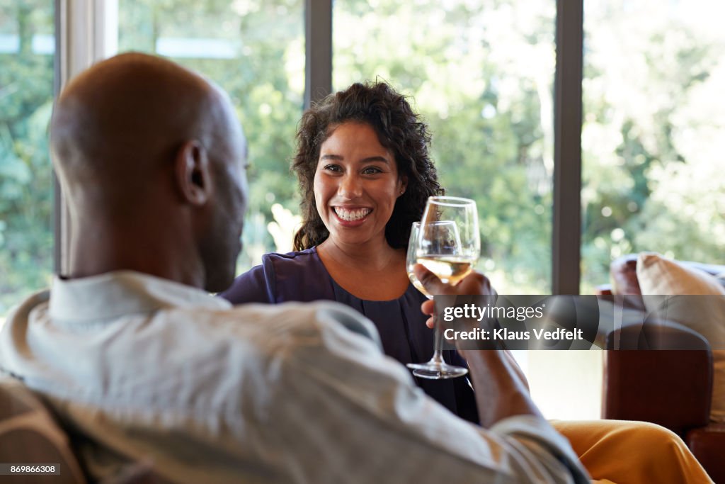 Couple toasting in wine