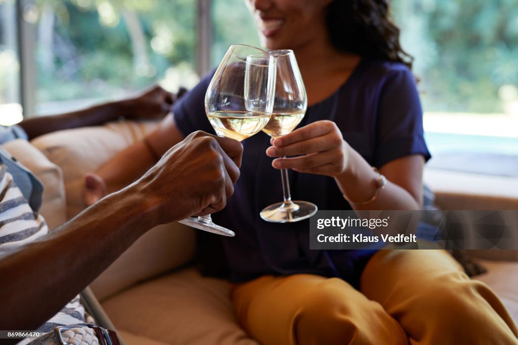 Couple toasting in wine