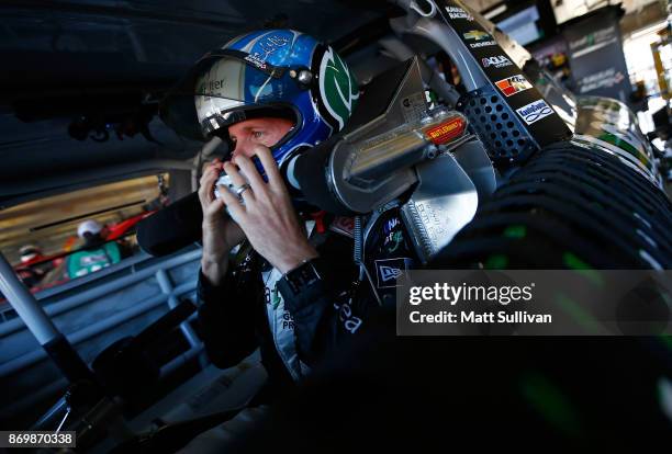 Blake Koch, driver of the LeafFilter Gutter Protection Chevrolet, sits in his car during practice for the NASCAR XFINITY Series O'Reilly Auto Parts...