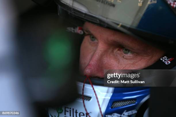 Blake Koch, driver of the LeafFilter Gutter Protection Chevrolet, sits in his car during practice for the NASCAR XFINITY Series O'Reilly Auto Parts...