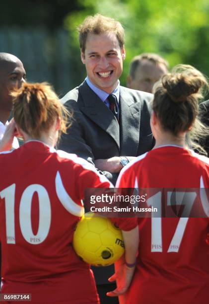 Prince William, President of The Football Association, meets young players as he visits Kingshurst Sporting FC on May 11, 2009 in Kingshurst,...