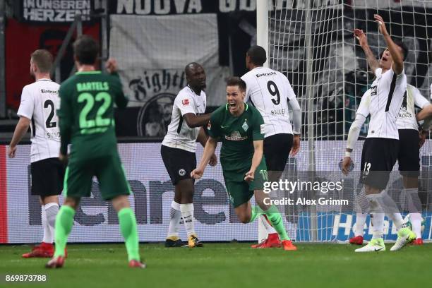 Niklas Moisander of Bremen celebrates his team's first goal during the Bundesliga match between Eintracht Frankfurt and SV Werder Bremen at...