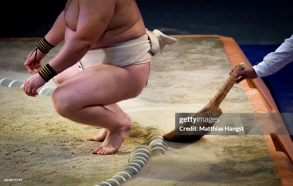 Sumo Judge A judge prepares the ring during the Sumo Open Weight Men's... News ...