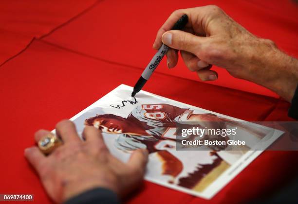 Professional Football Hall of Fame linebacker Nick Buoniconti has trouble autographing a photograph of himself when he played for the Dolphins after...