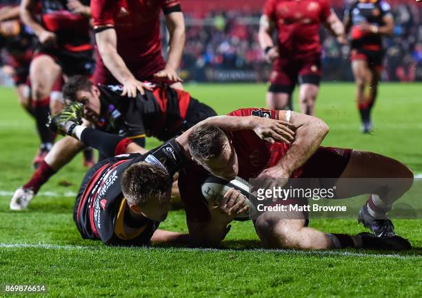 Cork , Ireland - 3 November 2017; Rory Scannell of Munster scores the first try despite the efforts of Will Talbot-Davies of Dragons during the...