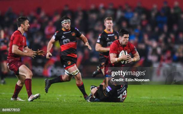 Cork , Ireland - 3 November 2017; Alex Wootton of Munster is tackled by Adam Warren of Dragons during the Guinness PRO14 Round 8 match between...