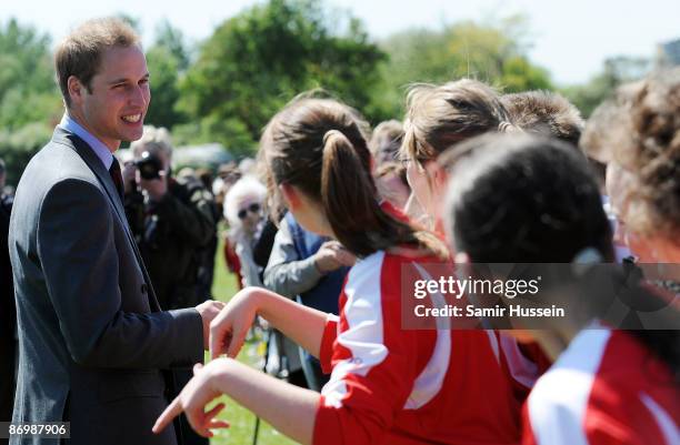 Prince William, President of The Football Association meets members of the public as he visits Kingshurst Sporting FC on May 11, 2009 in Kingshurst,...