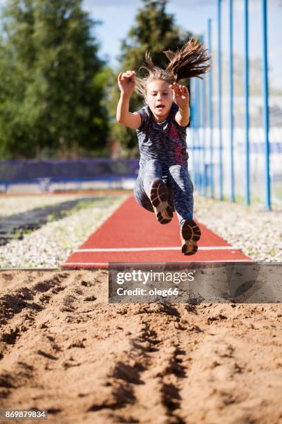 girl teenager trains in long jump - long jump stock pictures, royalty-free photos & images