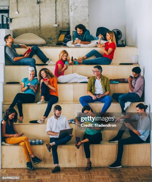 different lifestyles concept - laptop sitting on stack of books stock pictures, royalty-free photos & images