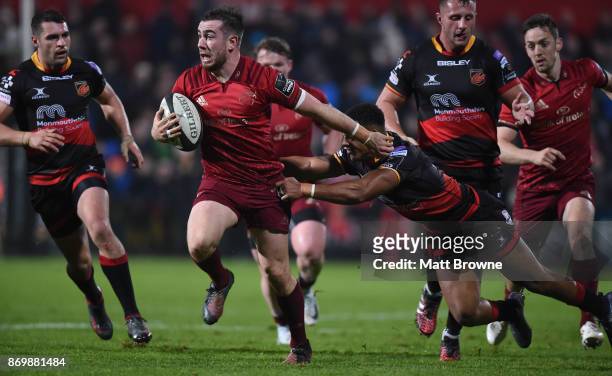 Cork , Ireland - 3 November 2017; JJ Hanrahan of Munster is tackled by Ashton Hewitt of Dragons during the Guinness PRO14 Round 8 match between...