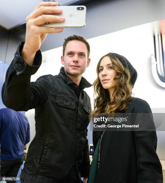 Actors Patrick Adams and Troian Bellisario stop by Apple Store Eaton Centre in Toronto for new iPhone X at Apple Store Eaton Centre on November 3,...