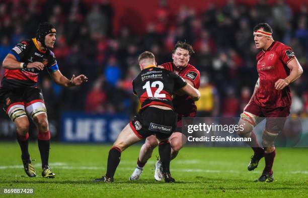 Cork , Ireland - 3 November 2017; Chris Cloete of Munster is tackled by Jack Dixon of Dragons during the Guinness PRO14 Round 8 match between Munster...