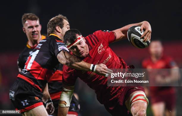 Cork , Ireland - 3 November 2017; Robin Copeland of Munster is tackled by Sarel Pretorius of Dragons during the Guinness PRO14 Round 8 match between...