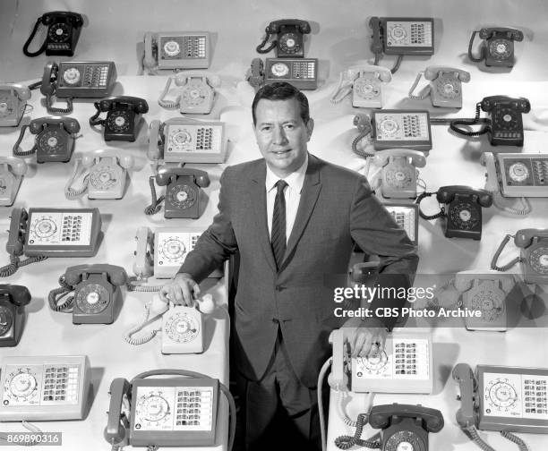 Newsman Douglas Edwards with an array of telephones. They prepare to report on the 1960 primary elections and national conventions. April 8, 1960....