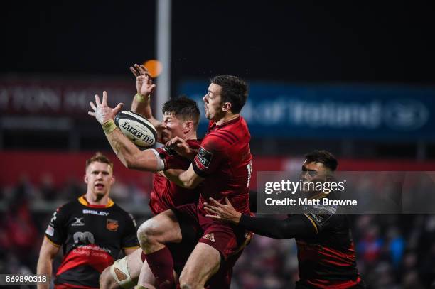 Cork , Ireland - 3 November 2017; Jack O'Donoghue and Darren Sweetnam of Munster in action against Jared Rosser of Dragons during the Guinness PRO14...