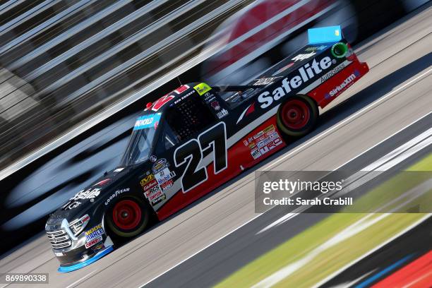 Ben Rhodes, driver of the Safelite Auto Glass Toyota, drives during Salute To Veterans Qualifying Days Fueled by Texas Lottery for the NASCAR Camping...