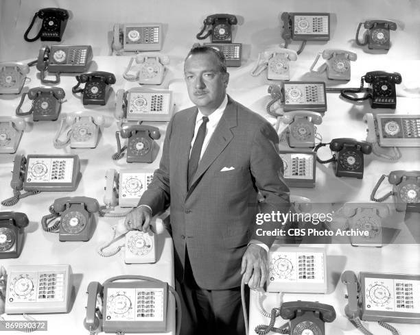 Newsman Walter Cronkite with an array of telephones. They prepare to report on the 1960 primary elections and national conventions. April 8, 1960....