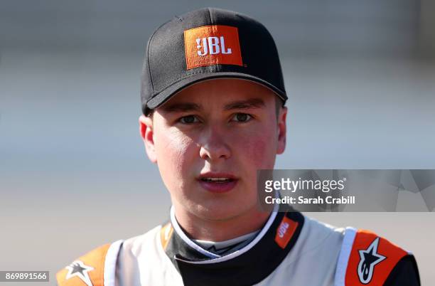 Christopher Bell, driver of the JBL Toyota, stands on the grid during Salute To Veterans Qualifying Days Fueled by Texas Lottery for the NASCAR...