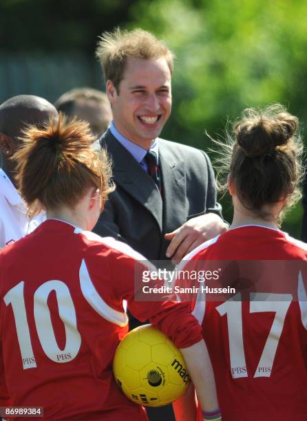 Prince William, President of The Football Association, meets young players as he visits Kingshurst Sporting FC on May 11, 2009 in Kingshurst,...