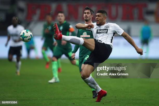 Simon Falette of Frankfurt clears the ball ahead of Fin Bartels of Bremen during the Bundesliga match between Eintracht Frankfurt and SV Werder...